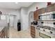 Kitchen with stainless steel appliances, granite counters, and access to hallway at 1109 Sloop Dr, Las Vegas, NV 89128