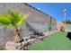 Landscaped yard with artificial turf and a palm tree at 1109 Sloop Dr, Las Vegas, NV 89128