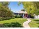 Curved walkway leads to this charming Ranch home at 1206 Douglas Dr, Las Vegas, NV 89102