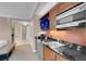 Modern kitchenette with stainless steel appliances and granite countertops at 135 E Harmon Ave # 2503, Las Vegas, NV 89109