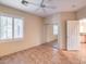 Bright bedroom with mirrored closet doors and tile floor at 17 Haig Point Ct, Henderson, NV 89052