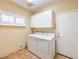 Laundry room with washer, dryer, and built-in cabinets at 17 Haig Point Ct, Henderson, NV 89052