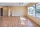 Large living room with tile floors and sliding glass doors at 17 Haig Point Ct, Henderson, NV 89052