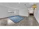 Living room with polished concrete floors and a blue rug at 1812 S 16Th St, Las Vegas, NV 89104