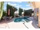 Private backyard with a refreshing pool, spa, and patio seating at 2112 Brighton Shore St, Las Vegas, NV 89128