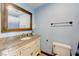 Bathroom with granite vanity and large ornate mirror at 2215 Mccarran St, North Las Vegas, NV 89030