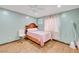 Bedroom with hardwood floors, ceiling fan, and pink bedding at 2215 Mccarran St, North Las Vegas, NV 89030