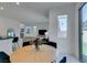 Modern dining area with a view of the living room and kitchen at 2676 Conifer Canyon St, Henderson, NV 89044