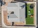 Aerial view of home featuring a well-kept lawn, trampoline, and outdoor furniture set for entertaining at 2690 Diamante Cir, Las Vegas, NV 89121