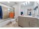 Modern bathroom with a sleek vanity, a spacious mirror, and a shower-tub combination at 2690 Diamante Cir, Las Vegas, NV 89121