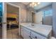 Spacious bathroom with vanity, sink, mirror, and tile flooring at 2690 Diamante Cir, Las Vegas, NV 89121