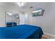 Bright bedroom featuring a sliding closet and a wall-mounted TV for entertainment at 2690 Diamante Cir, Las Vegas, NV 89121