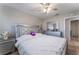 A silver bed frame is placed in the bedroom with ceiling fan and an ensuite bathroom at 2690 Diamante Cir, Las Vegas, NV 89121