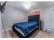 Cozy bedroom with a plush upholstered bed and a mounted TV for relaxation at 2690 Diamante Cir, Las Vegas, NV 89121