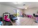 Versatile bonus room with a sliding glass door to the backyard with tiled floors at 2690 Diamante Cir, Las Vegas, NV 89121