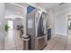 Stainless steel refrigerator adjacent to kitchen entrance and living space at 2690 Diamante Cir, Las Vegas, NV 89121