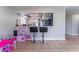 A breakfast bar with two stools provides seating adjacent to an open kitchen space at 2690 Diamante Cir, Las Vegas, NV 89121