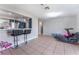 A bright and airy living room features tiled floors, a breakfast bar, and easy access to the kitchen at 2690 Diamante Cir, Las Vegas, NV 89121