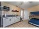 Bright and open living space featuring a kitchenette and bunk beds for versatile living at 2690 Diamante Cir, Las Vegas, NV 89121
