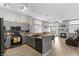 Modern kitchen with gray cabinets and granite countertops at 3090 Quail Crest Ave, Henderson, NV 89052