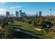 Aerial view of the golf course with city skyline in background at 3111 Bel Air Dr # 20H, Las Vegas, NV 89109