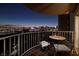 Evening city views from private balcony with seating at 3111 Bel Air Dr # 20H, Las Vegas, NV 89109
