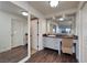 Vanity with granite countertop and large mirror at 3111 Bel Air Dr # 20H, Las Vegas, NV 89109