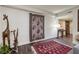 Bright entryway with hardwood floors and large area rug at 3111 Bel Air Dr # 20H, Las Vegas, NV 89109