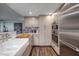 Modern kitchen with stainless steel appliances and farmhouse sink at 3111 Bel Air Dr # 20H, Las Vegas, NV 89109