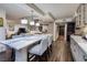 Open concept kitchen with large marble island and breakfast bar at 3111 Bel Air Dr # 20H, Las Vegas, NV 89109