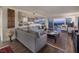 Spacious living room with hardwood floors and large windows at 3111 Bel Air Dr # 20H, Las Vegas, NV 89109