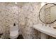 Charming powder room with bird wallpaper and pedestal sink at 3111 Bel Air Dr # 20H, Las Vegas, NV 89109