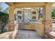 Outdoor grilling station with stone accents and seating at 3145 E Flamingo Rd # 2122, Las Vegas, NV 89121