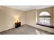 Bedroom with arched window and nightstand at 3145 E Flamingo Rd # 2122, Las Vegas, NV 89121