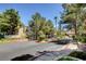 Community entrance with landscaping and gated access at 3145 E Flamingo Rd # 2122, Las Vegas, NV 89121