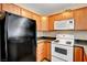 Well-equipped kitchen with wood cabinets at 3145 E Flamingo Rd # 2122, Las Vegas, NV 89121