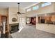 Open living area with high ceilings, fireplace, and kitchen view at 3145 E Flamingo Rd # 2122, Las Vegas, NV 89121