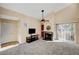 Bright living room with fireplace, TV, and access to patio at 3145 E Flamingo Rd # 2122, Las Vegas, NV 89121