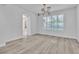 Formal dining room featuring wood-look floors and large windows at 35 Moraine Dr, Henderson, NV 89052