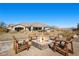 Inviting fire pit area with four chairs and home view at 421 Foxhall Rd, Henderson, NV 89002