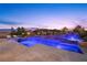 Luxury pool and spa with spacious patio at sunset at 421 Foxhall Rd, Henderson, NV 89002