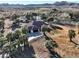 Aerial view of home near a pond, surrounded by palm trees at 4255 W State Highway 168, Moapa, NV 89025