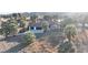 Aerial view of a home with palm trees and a large yard at 4255 W State Highway 168, Moapa, NV 89025