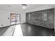 Spacious bedroom with stone wall and sliding doors at 4255 W State Highway 168, Moapa, NV 89025