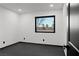 Small bedroom with single window and dark gray floors at 4255 W State Highway 168, Moapa, NV 89025