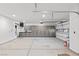 Large garage with ample storage cabinets and two garage doors at 4255 W State Highway 168, Moapa, NV 89025