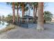 Dark gazebo with deck and metal railings next to pond at 4255 W State Highway 168, Moapa, NV 89025