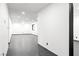 Long hallway with dark gray tile floors and recessed lighting at 4255 W State Highway 168, Moapa, NV 89025