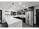 Modern kitchen with white quartz countertops and dark cabinetry at 4255 W State Highway 168, Moapa, NV 89025