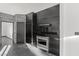 Sleek kitchen featuring dark cabinetry, stainless steel appliances, and granite countertops at 4255 W State Highway 168, Moapa, NV 89025